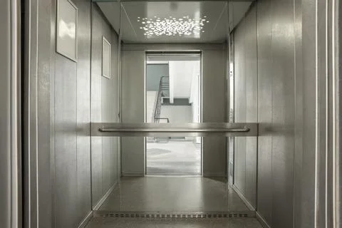 Open elevator`s cabin with big mirror indoors Fotos de archivo