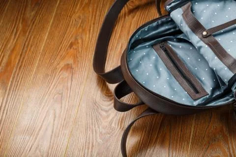 Open empty bag made of handmade genuine leather with elements of locks on a w Stockfoto's