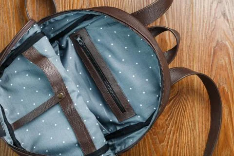 Open empty bag made of handmade genuine leather with elements of locks on a w Stockfoto's