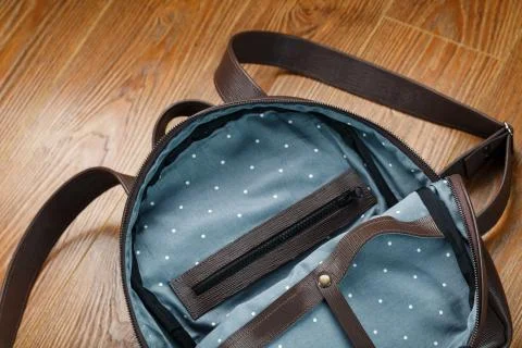 Open empty bag made of handmade genuine leather with elements of locks on a w Stockfoto's