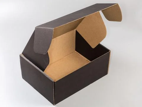 Open empty black cardboard box on a gray background Stock Photos