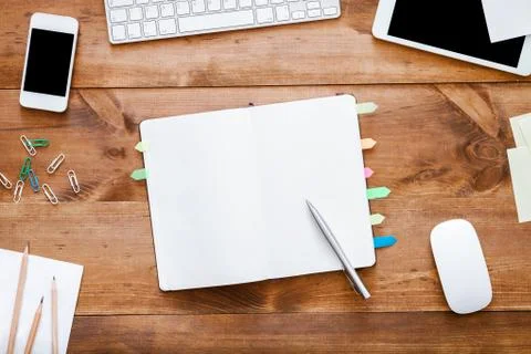 Open empty blank notebook organizer for planning on work table with devices Stock Photos