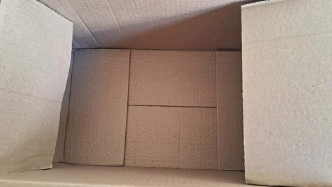 Open empty brown cardboard box viewed from a high angle perspective Stock Photos