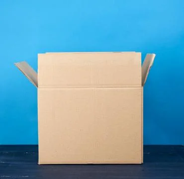 Open empty brown rectangular cardboard box for transporting goods Stock Photos