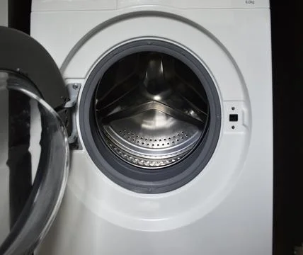 Open empty clean washing machine drum Фото