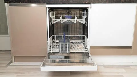 Open empty dishwasher with extended bottom shelf Stock Photos