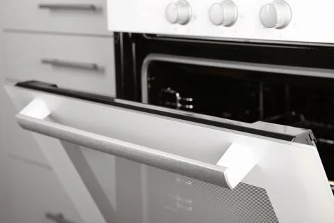 Open empty electric oven in kitchen, closeup 스톡 사진
