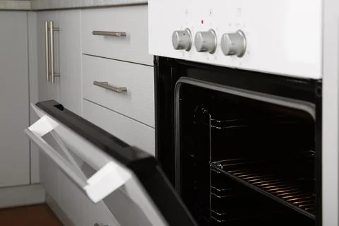 Open empty electric oven in kitchen, closeup 스톡 사진