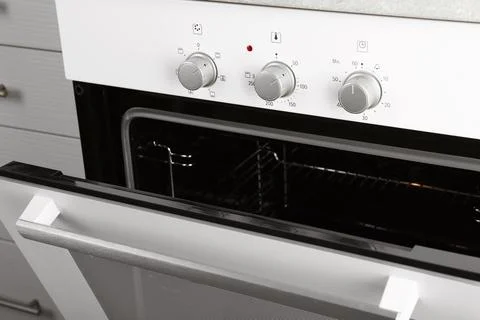 Open empty electric oven in kitchen, closeup Stock Photos