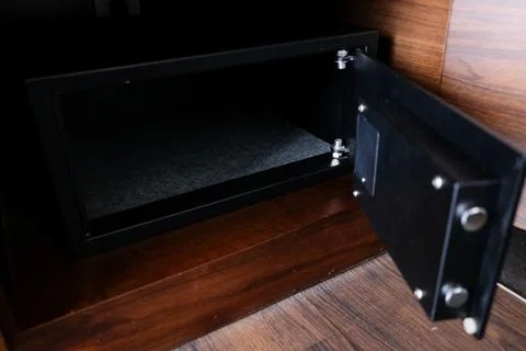 Open empty electronic security safe box in a hotel room Stock Photos