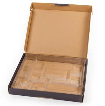 Open empty flat corrugated packing box with plastic spacer insert Stock Photos