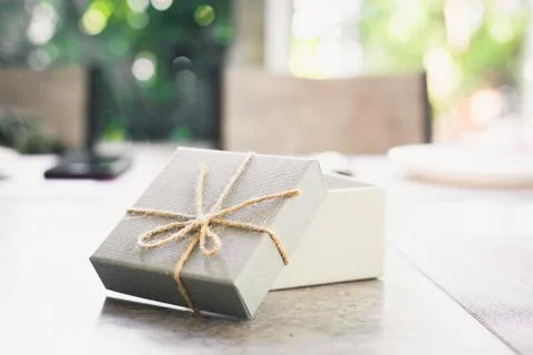 Open empty gift box on table.  A present on holiday. Stock Photos