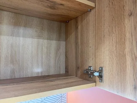 Open empty kitchen cabinet. Modern kitchen. Stock Photos