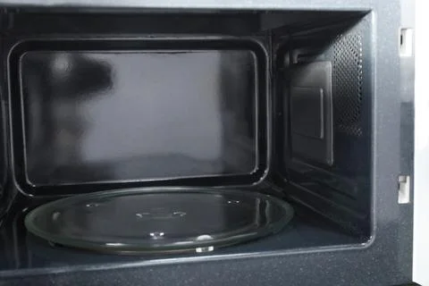 Open empty microwave oven, closeup. Inside view 写真素材
