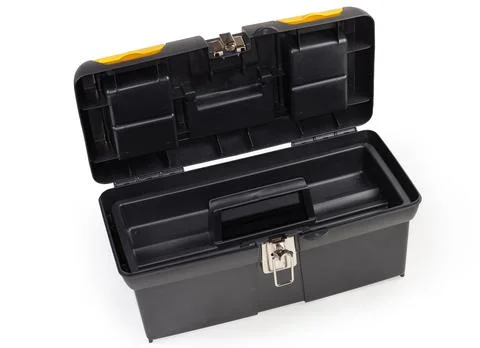 Open empty plastic portable multi-compartment toolbox on white background Stock Photos