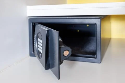 Open empty safe in a hotel room or home. Close-up of the mechanism of a sma.. Stock Photos