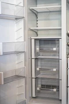 Open empty white refrigerator. Side View of Stainless Steel Double Door Foto stock
