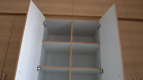 Open empty wooden wardrobe showcasing Stock Footage 149937477