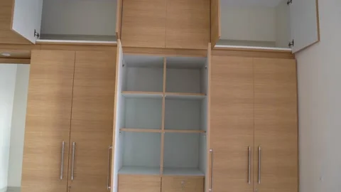 Open empty wooden wardrobe showcasing Stock Footage 149939083