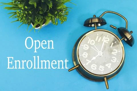 Open enrollment concept with alarm clock, time to registration Stock Photos