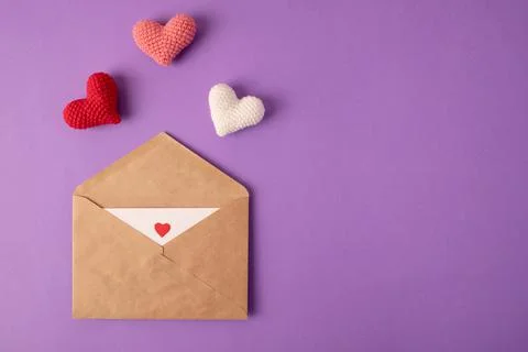 Open envelope with blank sheet of paper and beautiful red cute hearts Фото