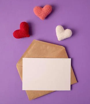 Open envelope with blank sheet of paper and beautiful red cute hearts Stock Photos