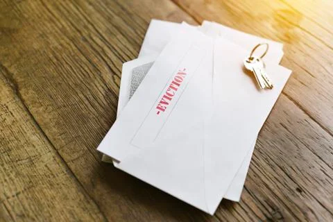 Open envelope with an eviction notice - Keys - Late rent - Overdue payment Stock Photos