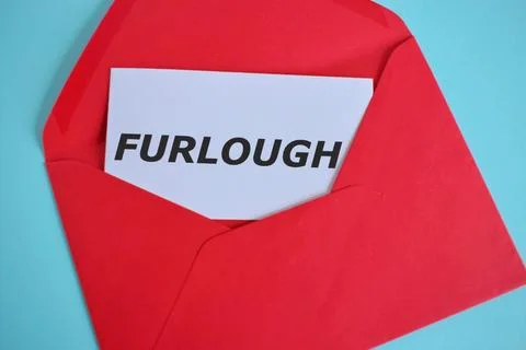 Open envelope with message FURLOUGH lockdown measure info concept. Conceptual Stock Photos