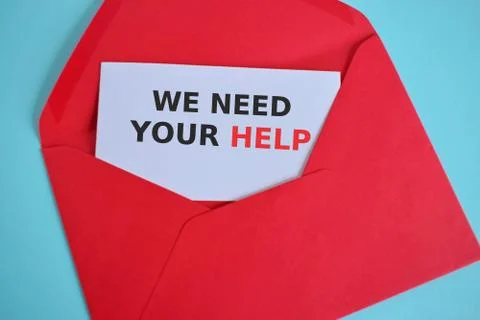 Open envelope with message WE NEED YOUR HELP. Stock Photos