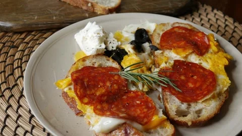 Open face breakfast toast with fried egg chorizo sausage Stock-Footage 335583981
