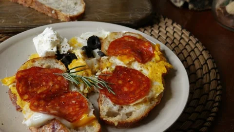 Open face breakfast toast with fried egg chorizo sausage Stock Footage 335711130