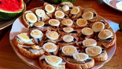 Open-Faced Sprat Sandwiches With Boiled Egg on Serving Platter Stock Footage 341542896