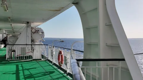 Open Ferry Deck with Green Flooring and Orange Life Ring Vidéo 347684382