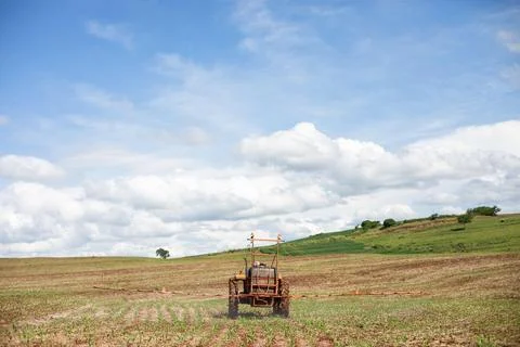 Open Field Spraying Tractor Stock Photos