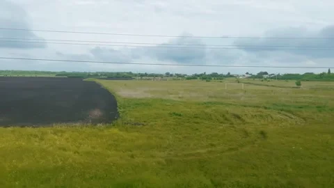 Open Field View From Train Window in Rural Area on Cloudy Day Video stock 278135990