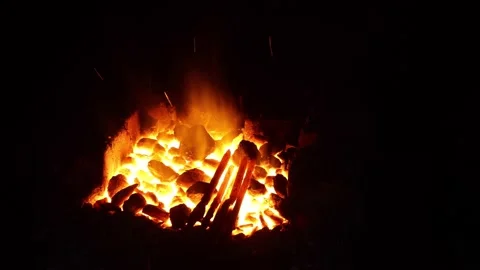 Open fire in the hearth Cleaning, igniting the horn. Sparks fly in.60 fps 4K UHD Stock Footage 198774261