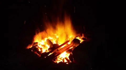 Open fire in the hearth Cleaning, igniting the horn. Sparks fly in.60 fps 4K UHD Stock Footage 200220526