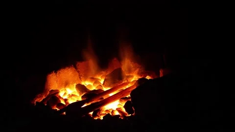 Open fire in the hearth Cleaning, igniting the horn. Sparks fly in.60 fps 4K UHD Stock Footage 201379816