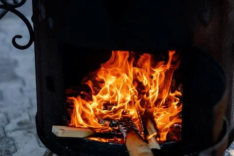 Open fire in a large cauldron Stock Photos