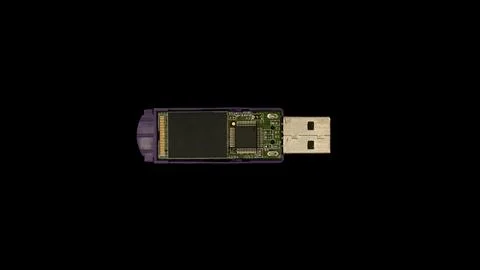 Open flash drive showing internal circuitry on black background Stock Photos