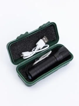 Open flashlight kit with charging cable Stock Photos