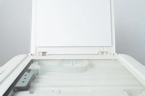 Open flatbed scanner with exposed glass platen and raised lid in a clean mode Stock Photos