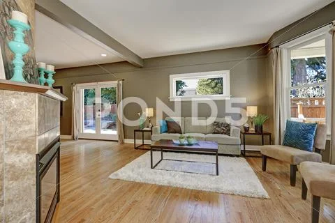 Open floor plan family room with green walls and hardwood floor. Northwest, U Stock Photos