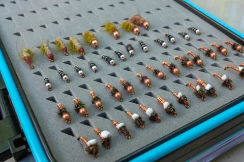 Open fly box with an assortment of flies Foto stock