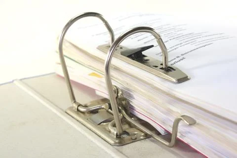 Open folder with filed documents against a white background 스톡 사진