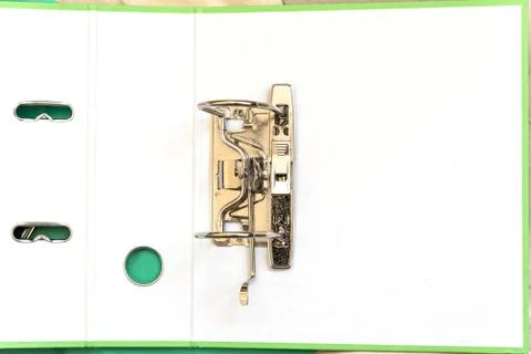 Open folder with metal clip for papers. Office tools. Copy space Stock Photos