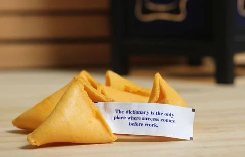 Open Fortune Cookie With Message The Dictionary is the Only Place Where Success 스톡 사진