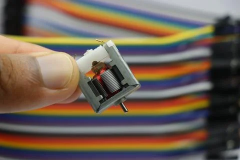 Open frame dc motor with visible shaft and copper windings Stock Photos