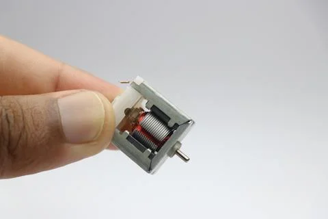 Open frame or the minimum frame type dc motor small in size held in hand Stock Photos