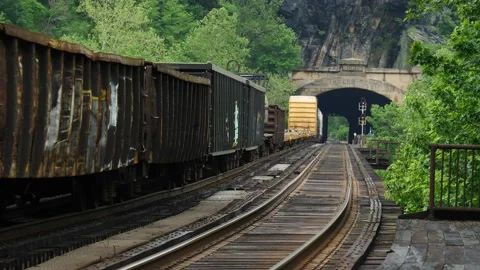 Open freight wagons or carriages on a goods train Stock Footage 150476365